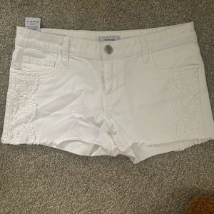 Low rise white denim shorts
